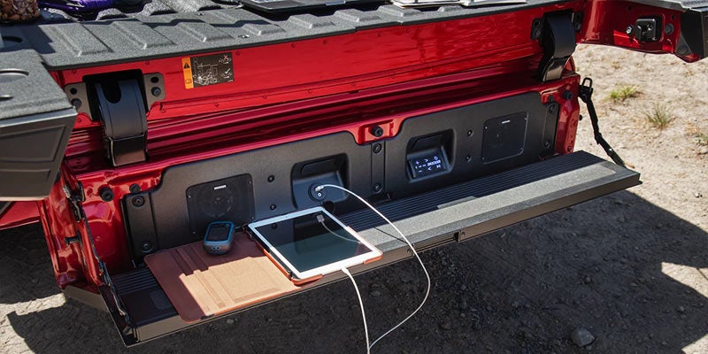 A tab is charging at rear side of truck