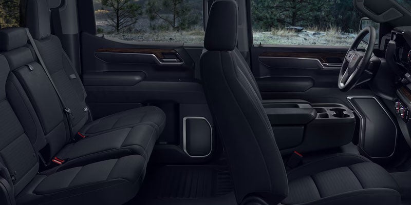Rear passenger seating and spacious cabin interior of the 2026 GMC Sierra 1500